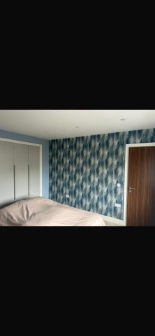 Modern wallpaper installation in Strathaven bedroom by Kastle Decor