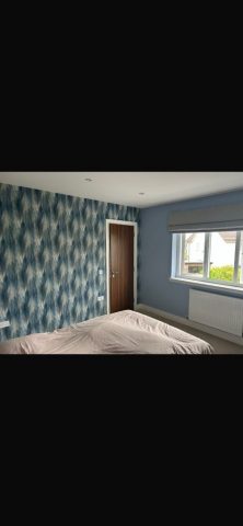 Modern wallpaper installation in Strathaven bedroom by Kastle Decor