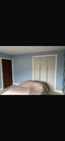 Modern wallpaper installation in Strathaven bedroom by Kastle Decor